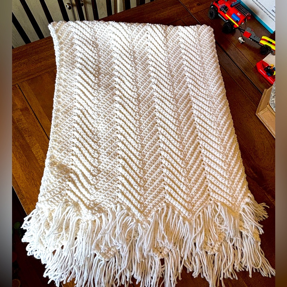 White colored homemade baby blanket